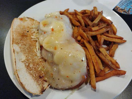 A Hot Italian sandwich and fries.