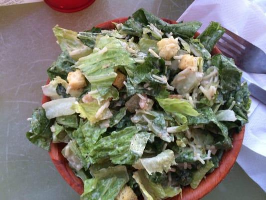 Ceasar salad. Dressing and cheese added when you order