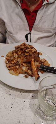 Grilled veal chop with sauteed onions and mushrooms cooked perfectly and very tender