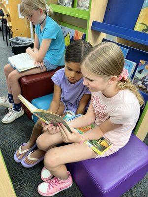 Cousins enjoying a good read.