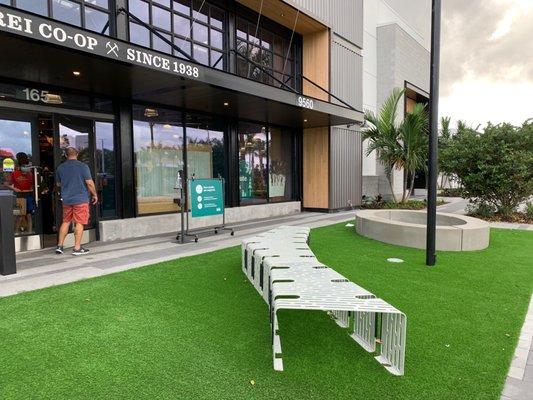 Entrance to REI with funky bench.