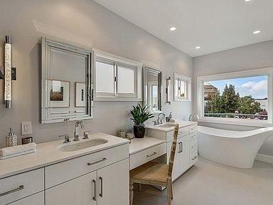 Custom-made his and hers vanity  Make up area  Bathtub with a view  Loving our New Master bathroom