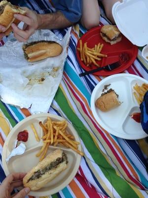 Our picnic spread - cheesesteaks and fries.