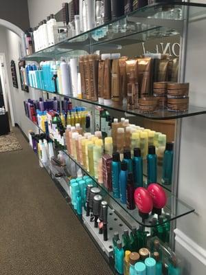 Section of salon featuring hair products available for sale.