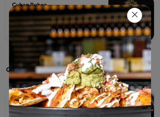 The menu version that has a mountain of guac and sour cream drizzled all over.