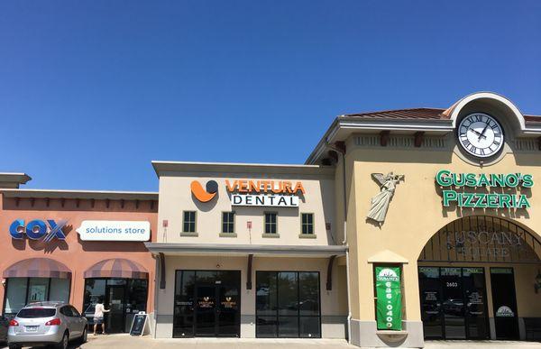 Ventura Dental is next to Gusano's Pizza in Tuscany Square