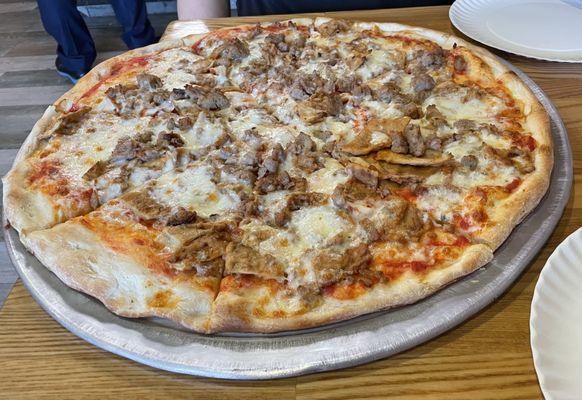 Large eggplant and sausage pizza