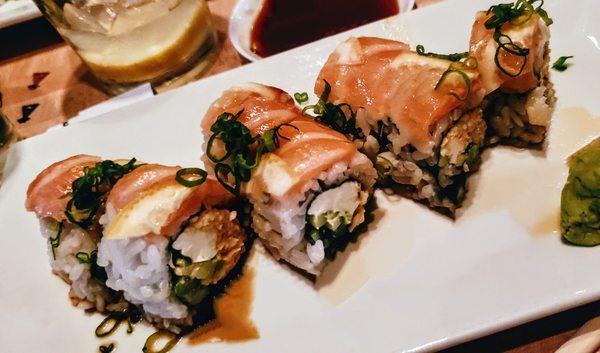 Sunshine Roll - salmon, spicy krab, cream cheese, avo, asparagus, scallions, sliced lemons, ponzu.