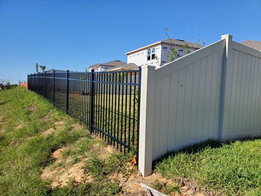 6x6 White Privacy Vinyl transitioned to 4x6 3 Rail Flat Top Aluminum