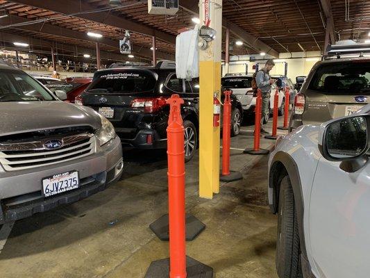 Downtown Oakland Subaru "waiting room" where you can stand in the cold and breathe exhaust for 30+ minutes.