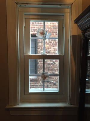 Double hung window installed at top of stairs. The molding work was existing so don't judge that