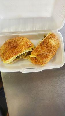 Sausage, egg and cheese croissant with jalapeño.