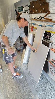 Jim McCue Measuring & Cutting New Drywall