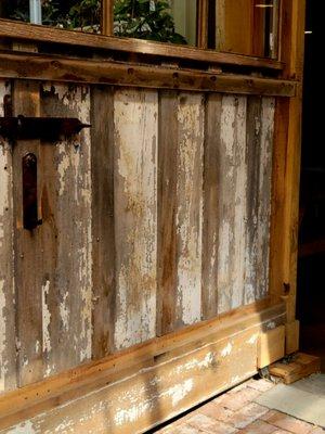 A weathered door leading inside.