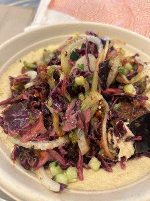 Falafel bowl with hummus, red cabbage, Suman onions, cucumber salad.