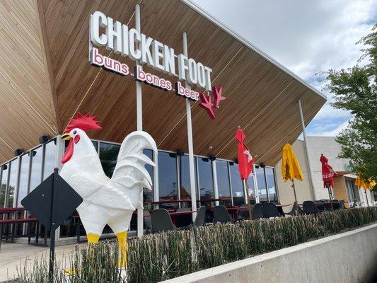 Cool exterior design w/patio and a big chicken