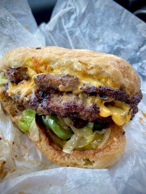 Double Cheeseburger, grilled mushrooms, jalapeño, pickles, & lettuce.