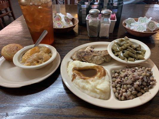 Meat and three with grilled chicken, creamed potatoes, green beans, and purple hulled peas.