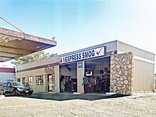 Storefront of A1 Express, owner standing between docks.