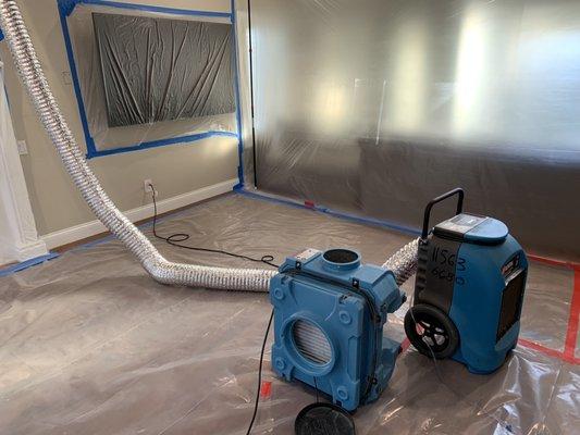 Dehumidifier duct directly into ceiling for drying, air scrubber running along side