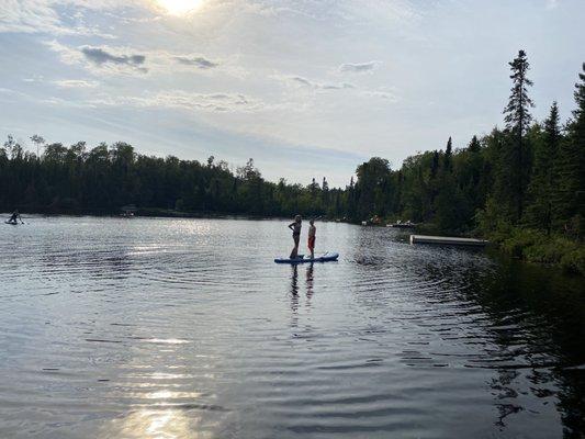 Our kids paddle boarding.