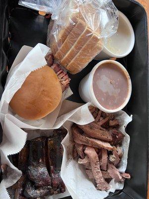 1 lb brisket, 1 lb of ribs and a brisket sandwich with 1/2 of bean and 1/2 pound of potato salad