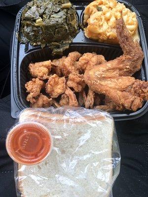 Half Pound of shrimp with collards & Mac & Cheese. Added a wing. And you HAVE to have hot sauce & white bread! 2-23-2019