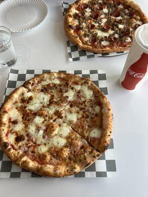 Cheese pizza and meat lovers pizza