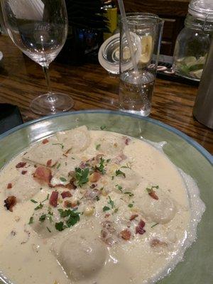 Homemade corn ravioli in a bacon cream sauce