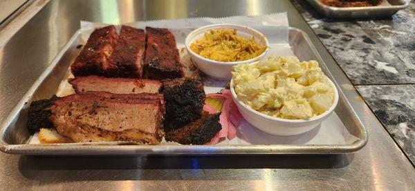 2 meat combo with brisket, ribs, potato salad, and slaw