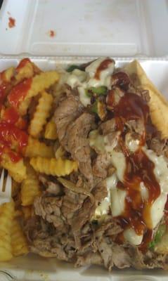 Steak and cheese with french fries. This thing was huge! About 8 bucks.