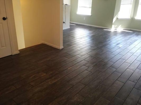 Here is a tile floor that I installed with "wood plank style" tiles that seem to be more popular these days. It adds a nice touch.