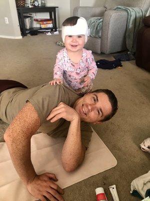 Her with her helmet. Happy baby.