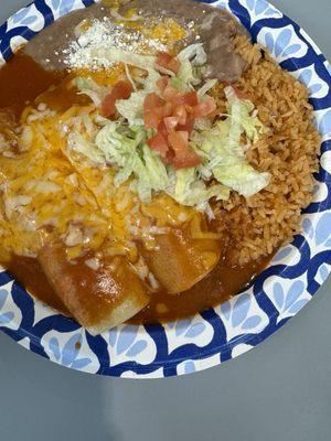 Shredded beef enchiladas with rice and beans