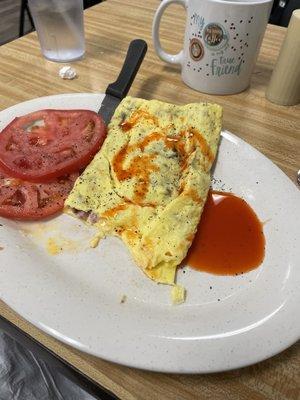 New England's 3 egg omelette with sliced tomatoes