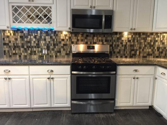 Custom cabinets, install backsplash and some led color lighting