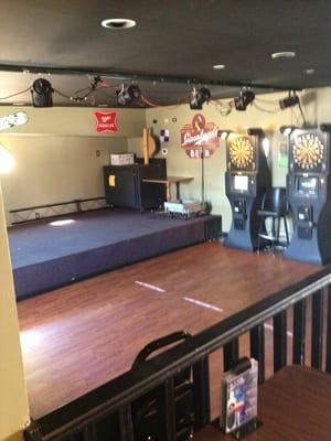 Stage for live music and dart league area