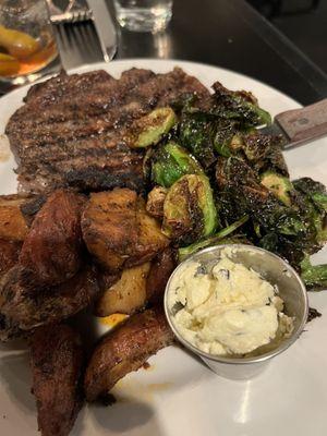 12 ounce ribeye with garlic butter, fried Brussel sprouts and roasted red potatoes.