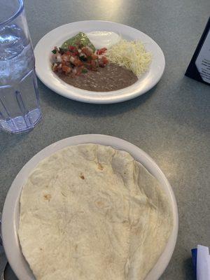 Lots of tortillas, cheese, beans, pico and guacamole came with fajitas.