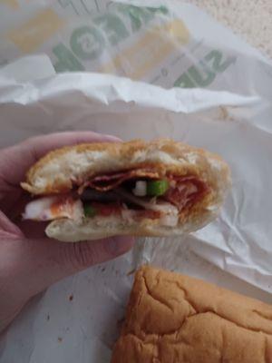 This is what you ACTUALLY get: A nearly meatless sandwich.  The images posted by Subway showing a packed sandwich are false advertising.