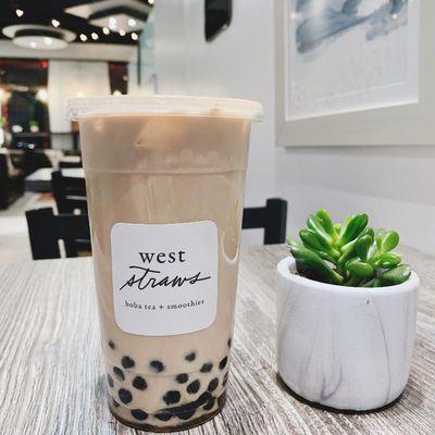 Grab a Jasmine Milk Tea for a perfect, floral pick-me-up. Pictured here with black boba.