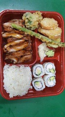 Delicious bento box with rice, California rolls, teriyaki chicken and veggie tempura! It's huge enough for two people!