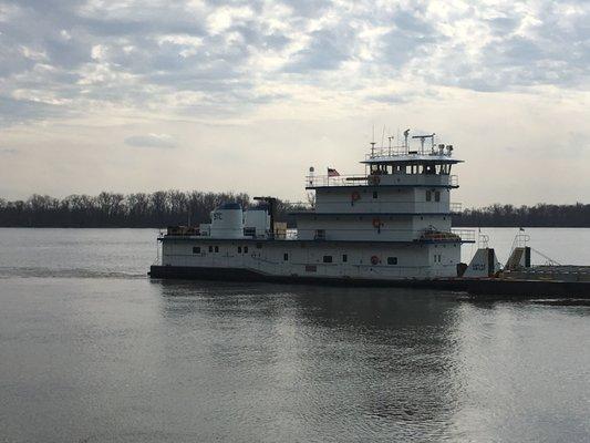 tugboat cruising the river near alton, il