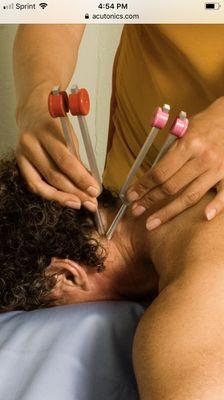 Acutonics sound healing tuning forks used on Shiatsu points for healing and relaxation.