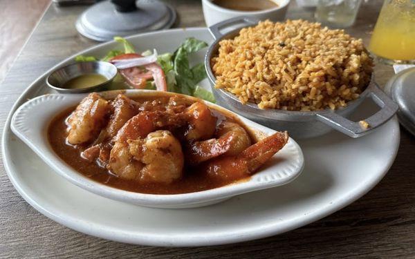 Shrimp in our red sauce with yellow rice n pigeon piece