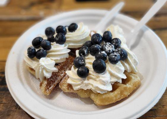 Hot croffle with whipped cream and fresh blue berries