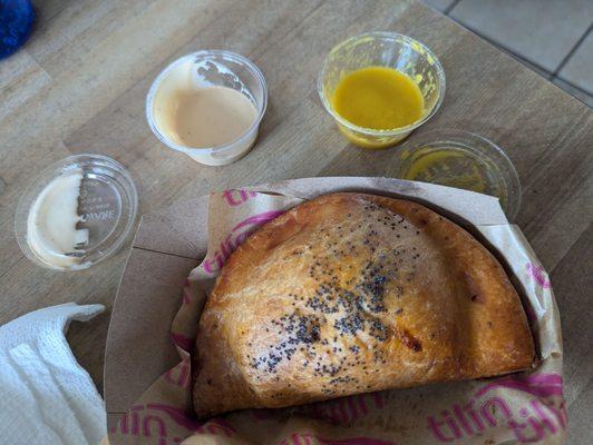 Pollo empanada with garliky mayo and habanero hot sauce