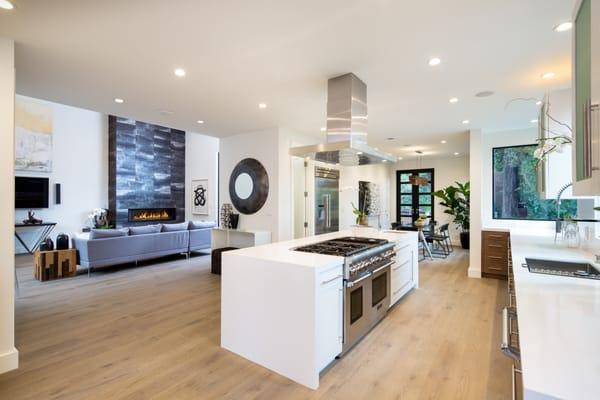 Kitchen with a view of the fireplace in a new home in Mill Valley, CA.