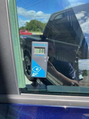 Reading of passenger side window tint (within legal limit for NC)