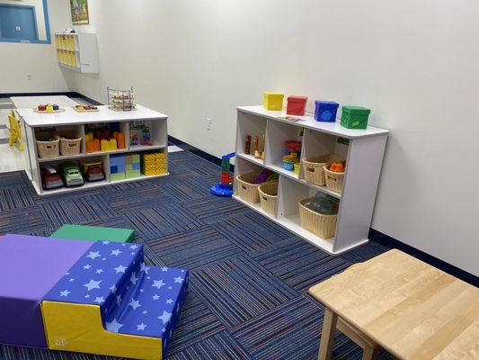 Toddler classroom with toys and climbing equipment